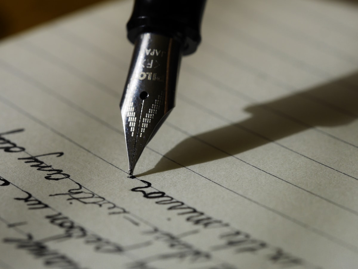 Person writing on laptop — freelance writing guide
